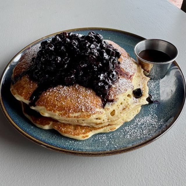 3 BLUEBERRY PANCAKES Served with/Maple Butter.